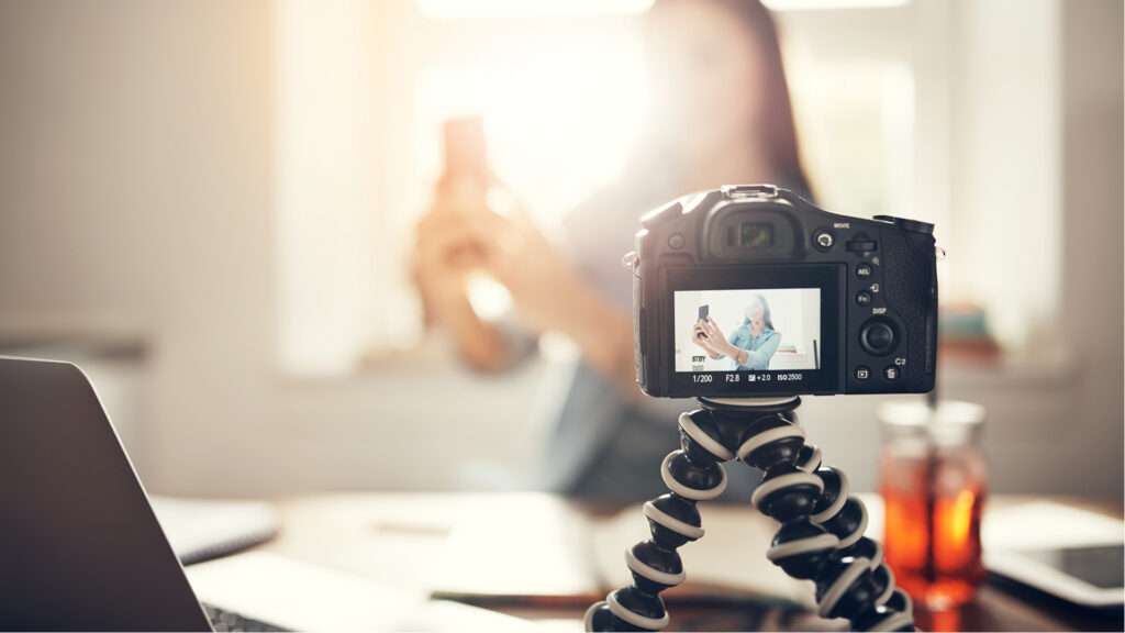 Camera taking a video of girl