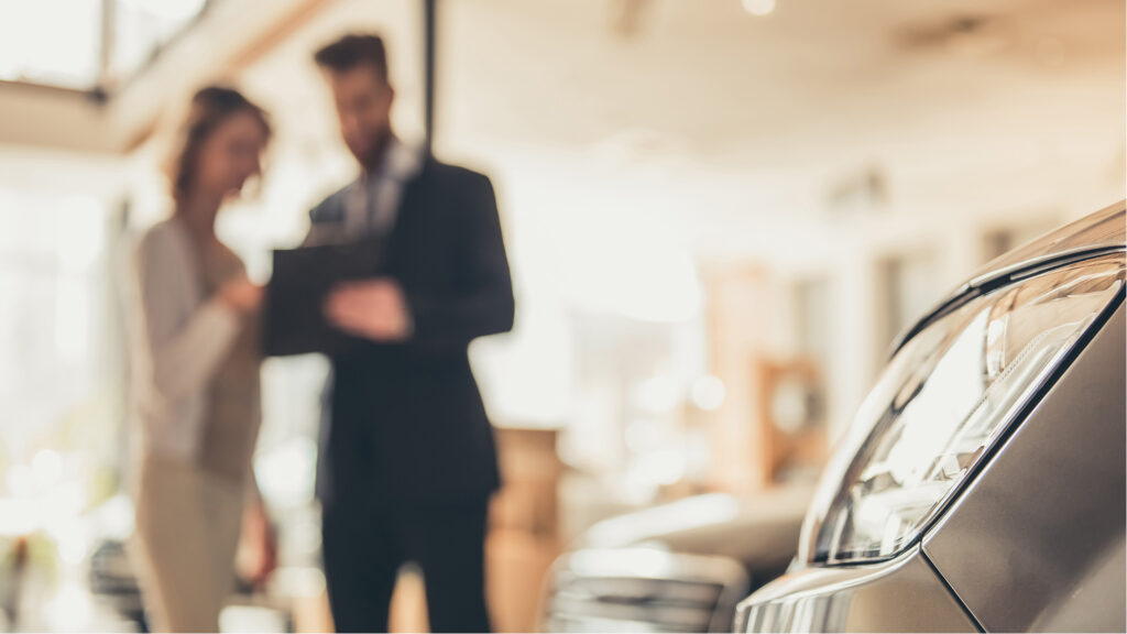 Salesman with customer in background