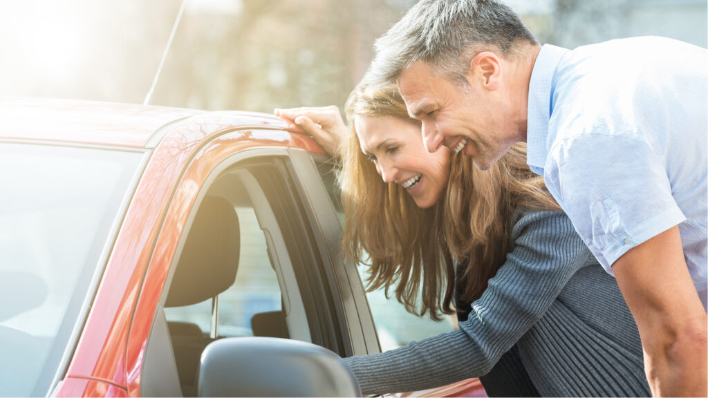Couple looking at car