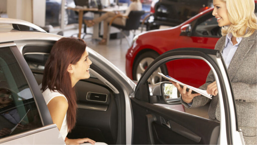Woman happy sitting in new car