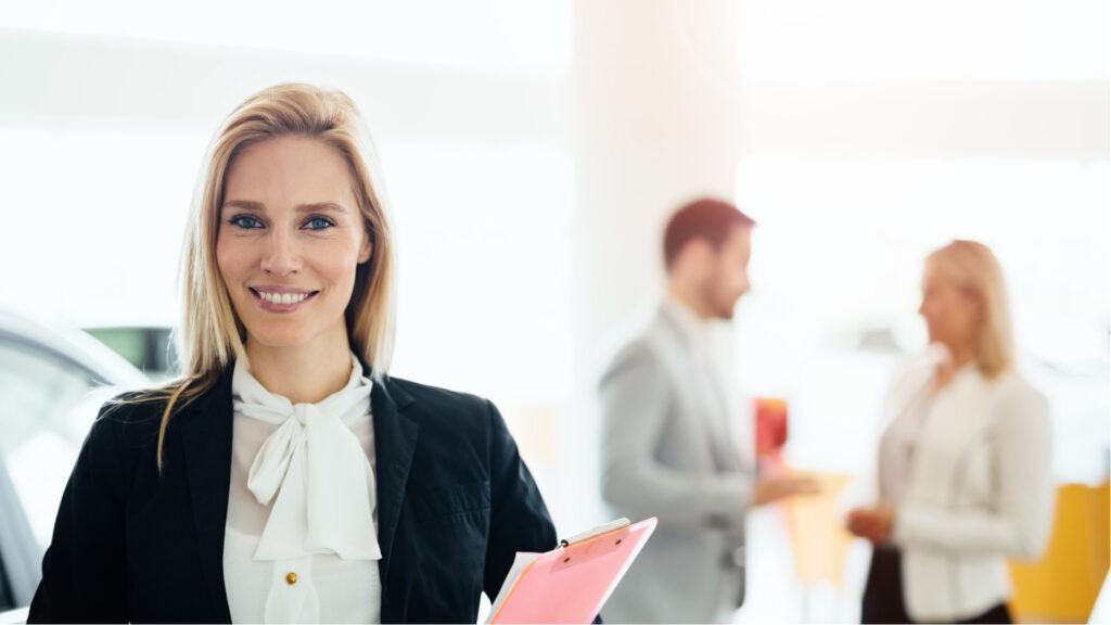 saleswoman smiling in front