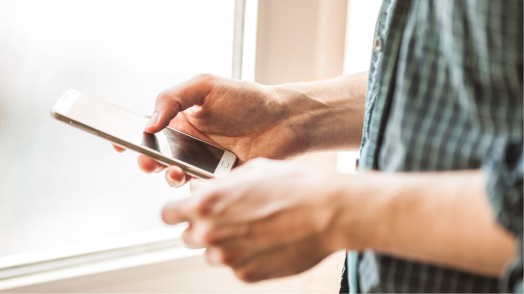 Guy holding phone