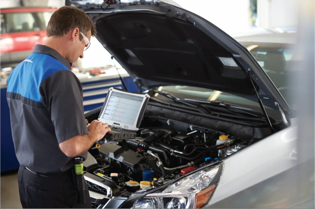 A technician is digitizing fixed ops via a mobile tablet.