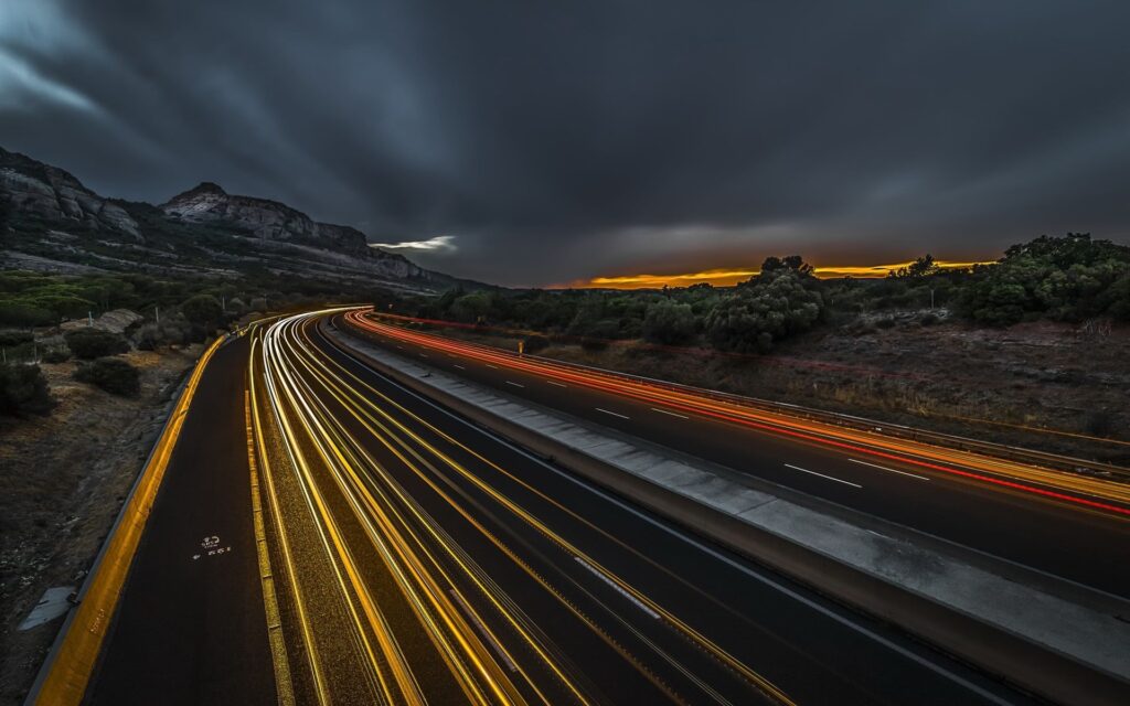 Auto dealership challenges represented by a highway blur.