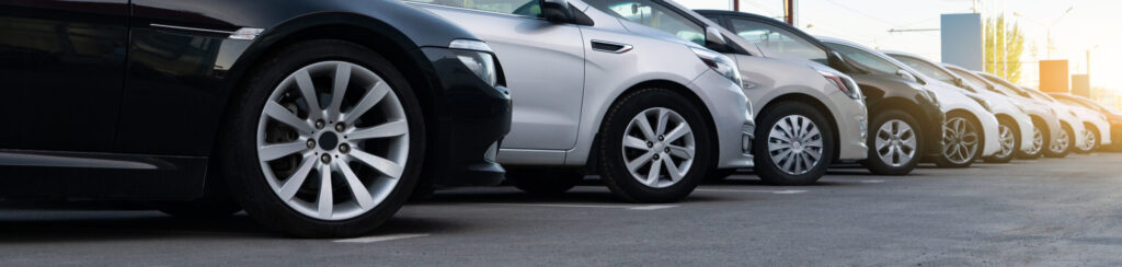 2023 automotive industry trends represented by a car lot.