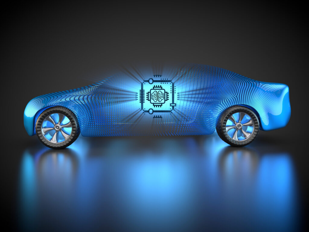The car chip shortage is represented by a large semiconductor symbol inside a car.