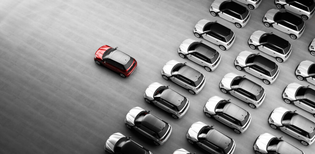 A car stands out as part of the new car inventory.