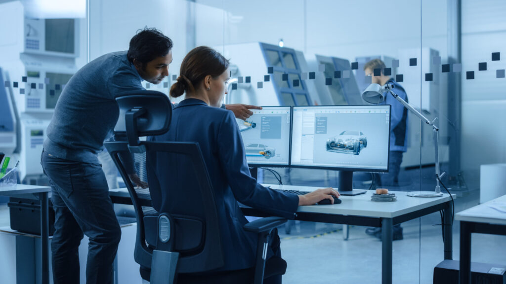 Engineers working to meet 2023 automotive technology trends.