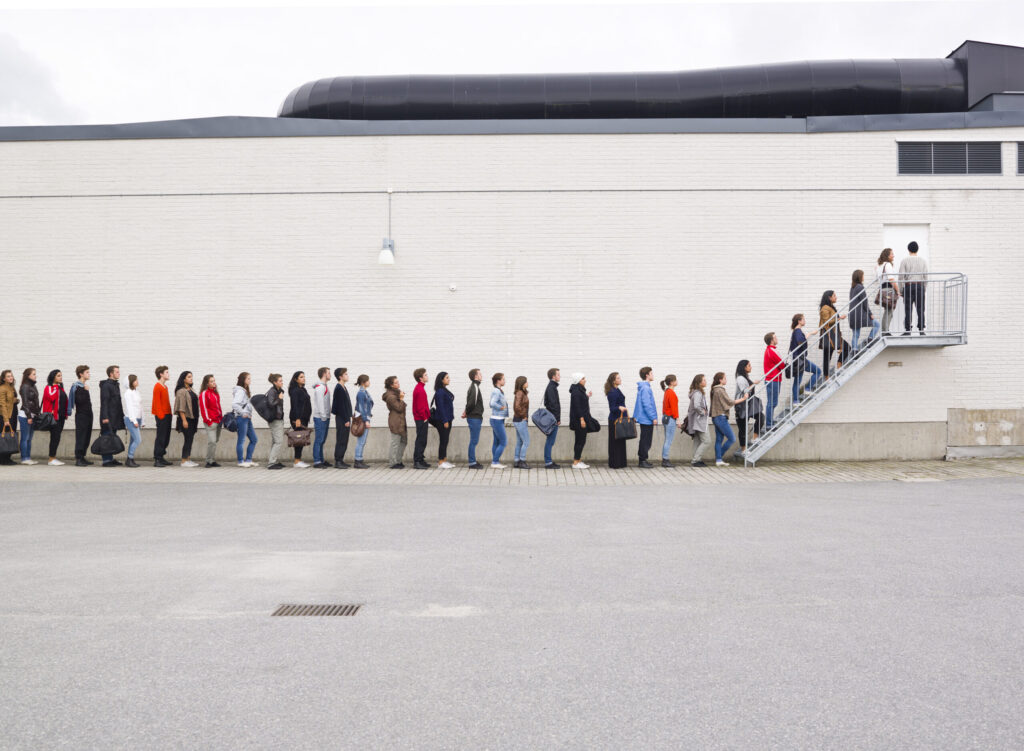 Repeat customers represented by long customer waiting lines.