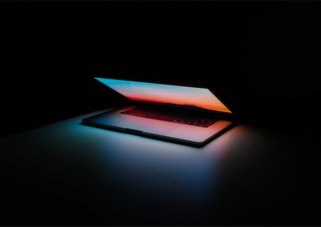 Website essentials represented by a laptop opening.